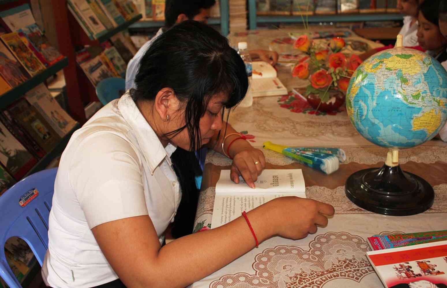 Student in school library, Cambodia - Credit: GPE/Livia Barton